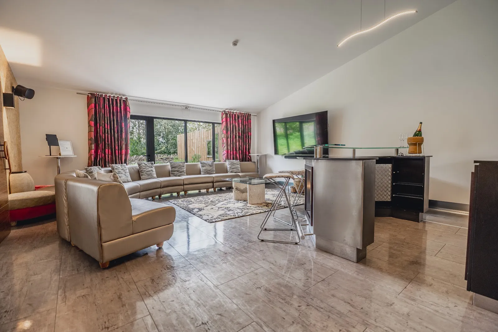 The private cinema, karaoke and bar lounge at Vedalworks, a group holiday house sleeping up to 24 in Long Sutton, Somerset