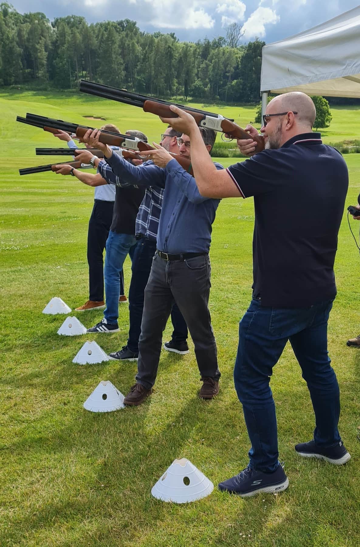 A group laser clay shooting on a field