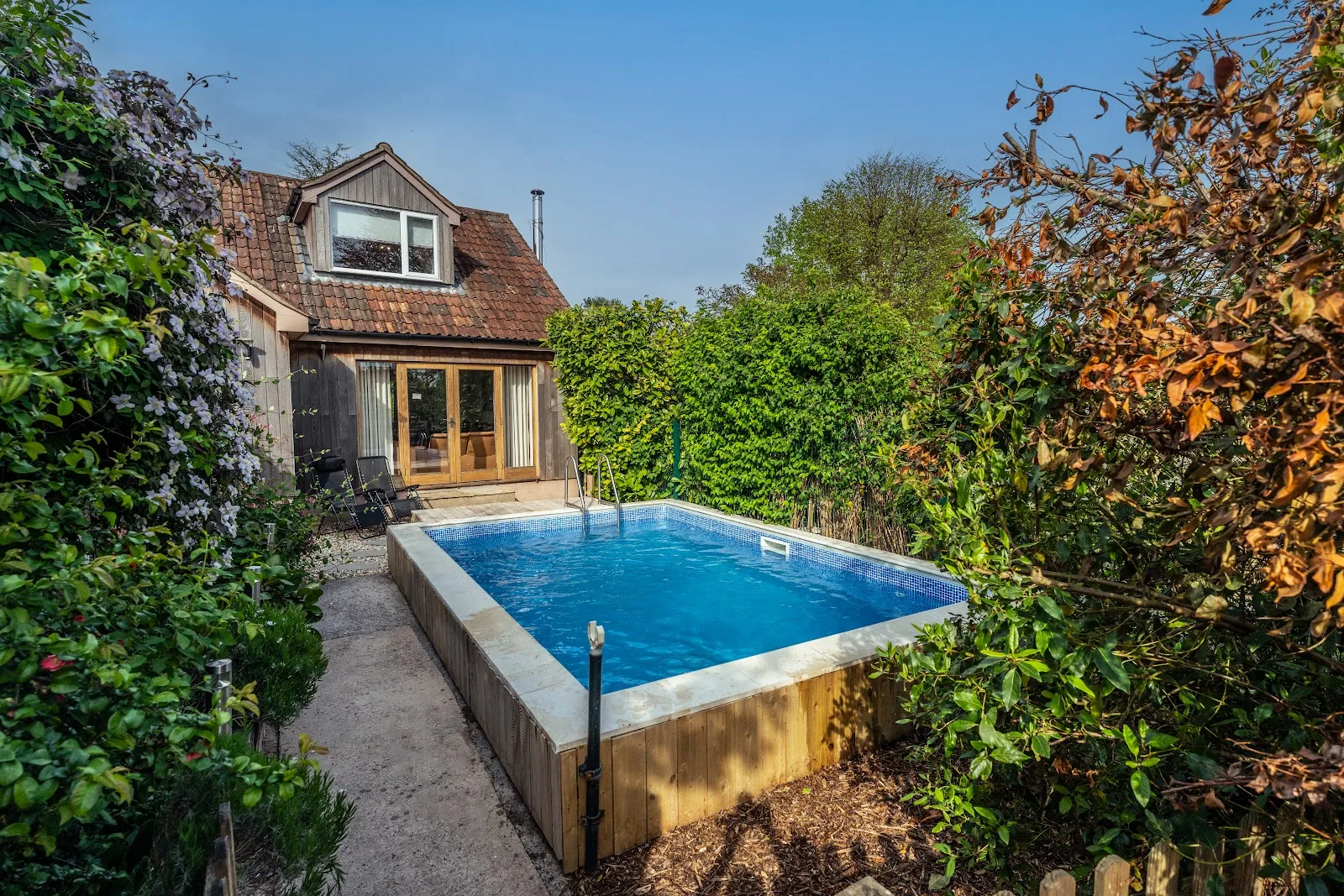 The private heated outdoor pool at Upton Bourn Lodge, open Easter–October
